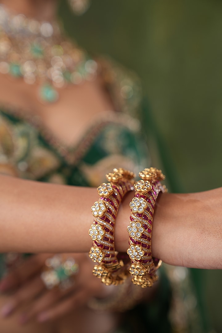 Gold Finish Kundan Polki & Red Stone Bangles (Set Of 2) by EKATHVA JAIPUR at Pernia's Pop Up Shop