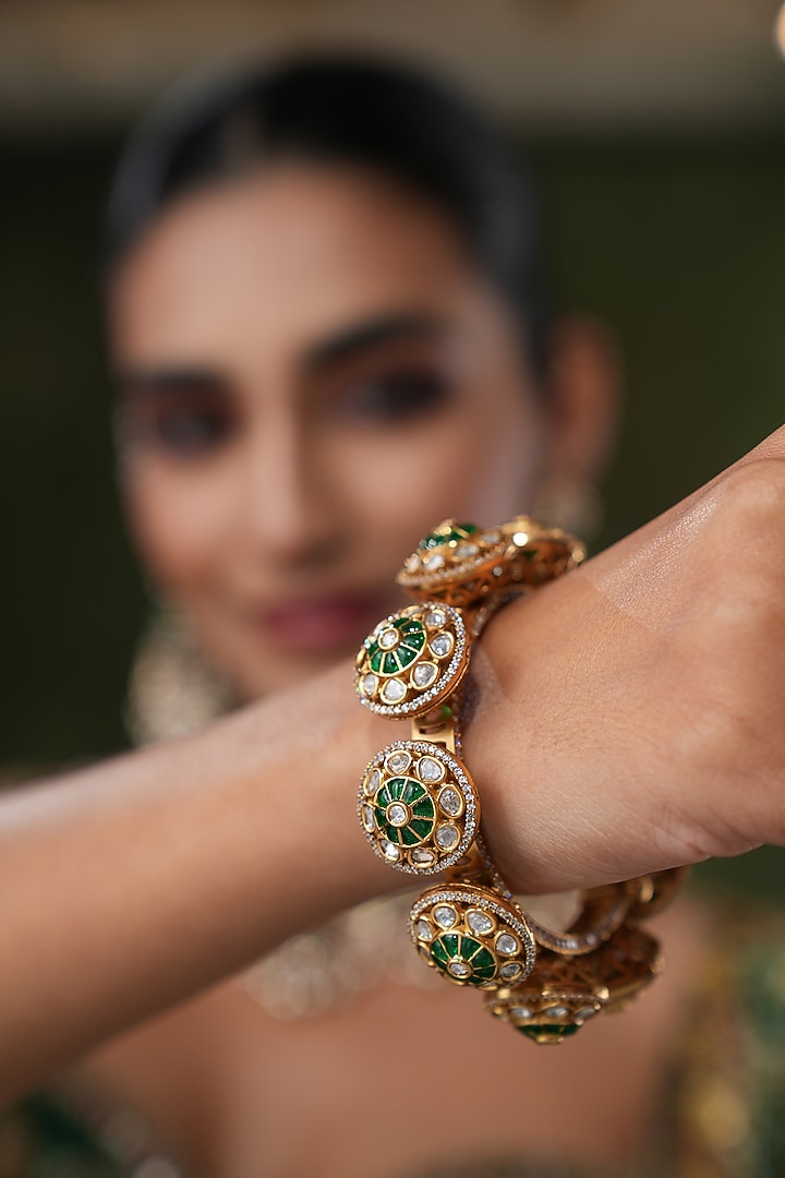Gold Finish Kundan Polki & Green Stone Bangles (Set Of 2) by EKATHVA JAIPUR at Pernia's Pop Up Shop
