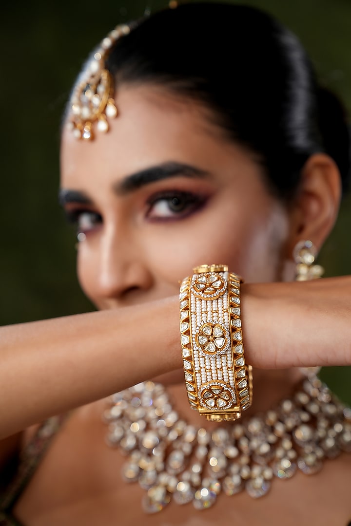 Gold Finish Kundan Polki Bangles (Set Of 2) by EKATHVA JAIPUR at Pernia's Pop Up Shop