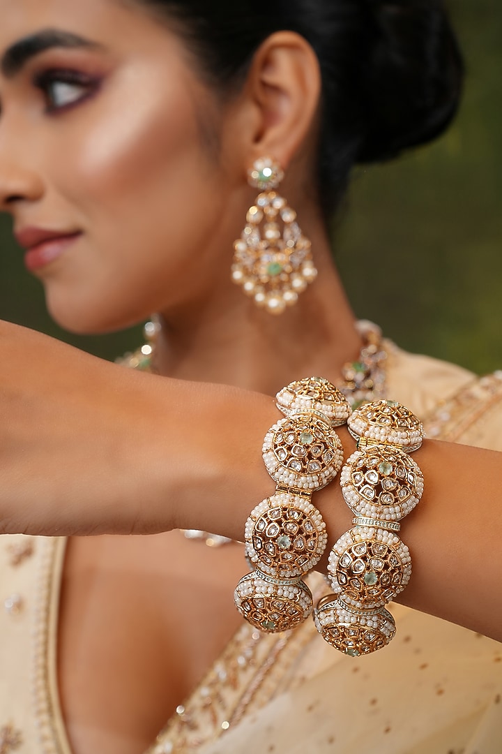 Gold Finish Kundan Polki Bangles (Set Of 2) by EKATHVA JAIPUR at Pernia's Pop Up Shop