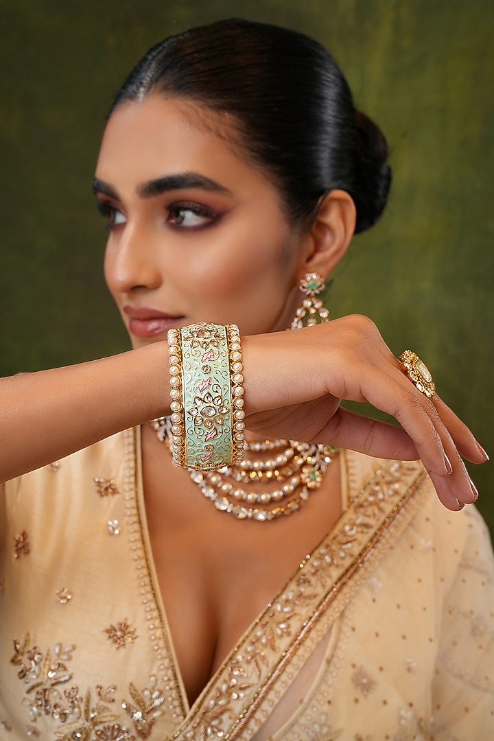 Gold Finish Kundan Polki & Mint Stone Bangles (Set Of 2) by EKATHVA JAIPUR at Pernia's Pop Up Shop