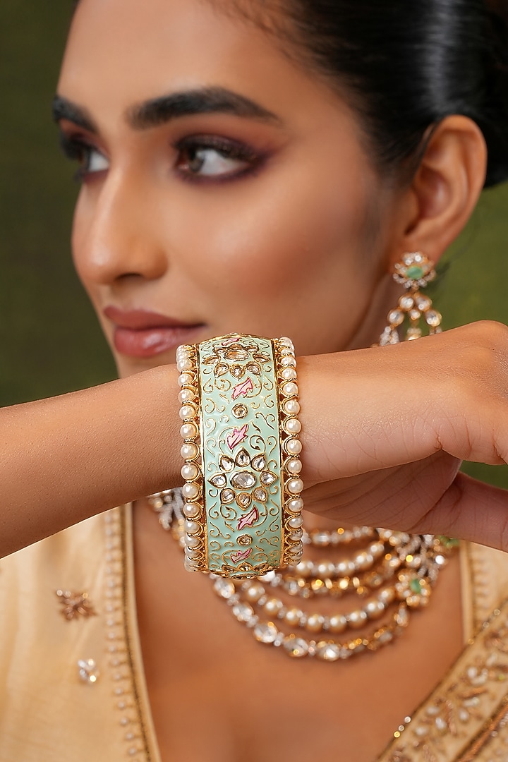 Gold Finish Kundan Polki & Mint Stone Bangles (Set Of 2) by EKATHVA JAIPUR at Pernia's Pop Up Shop
