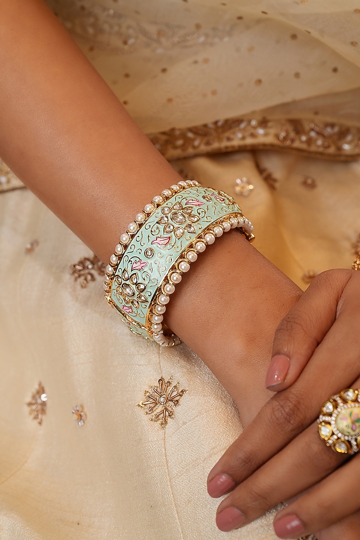 Gold Finish Kundan Polki & Mint Stone Bangles (Set Of 2) by EKATHVA JAIPUR at Pernia's Pop Up Shop