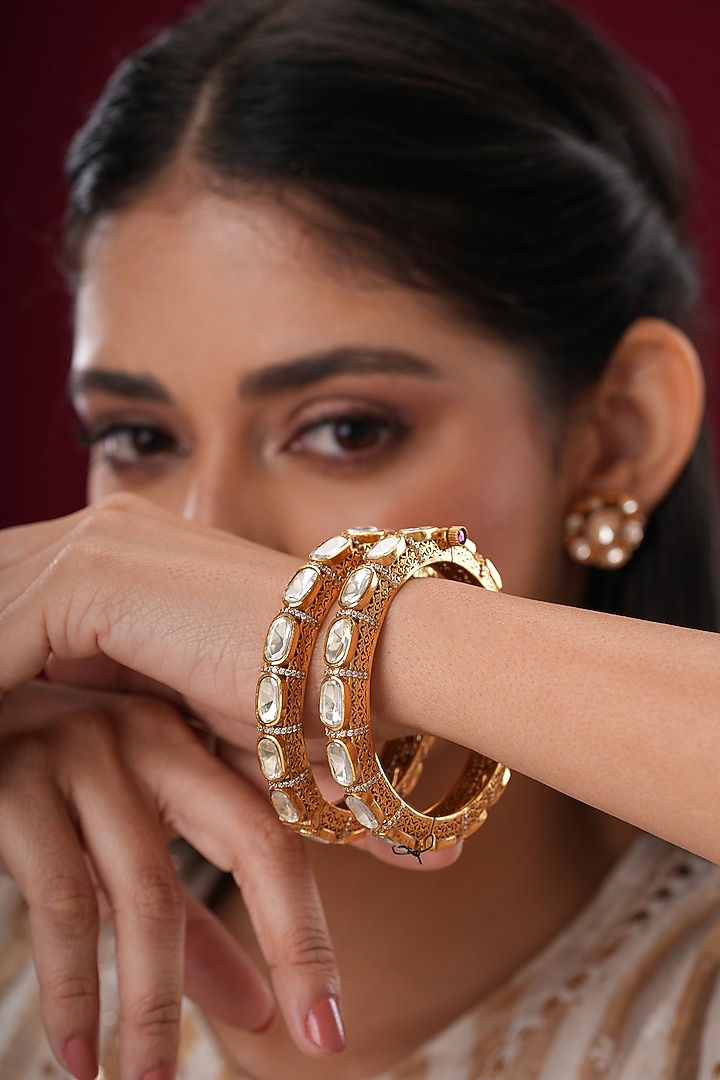 Gold Finish Kundan Polki Bangles (Set Of 2) by EKATHVA JAIPUR at Pernia's Pop Up Shop
