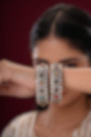 Gold Finish Kundan Polki & Multi-Colored Stone Bangles (Set Of 2) by EKATHVA JAIPUR at Pernia's Pop Up Shop