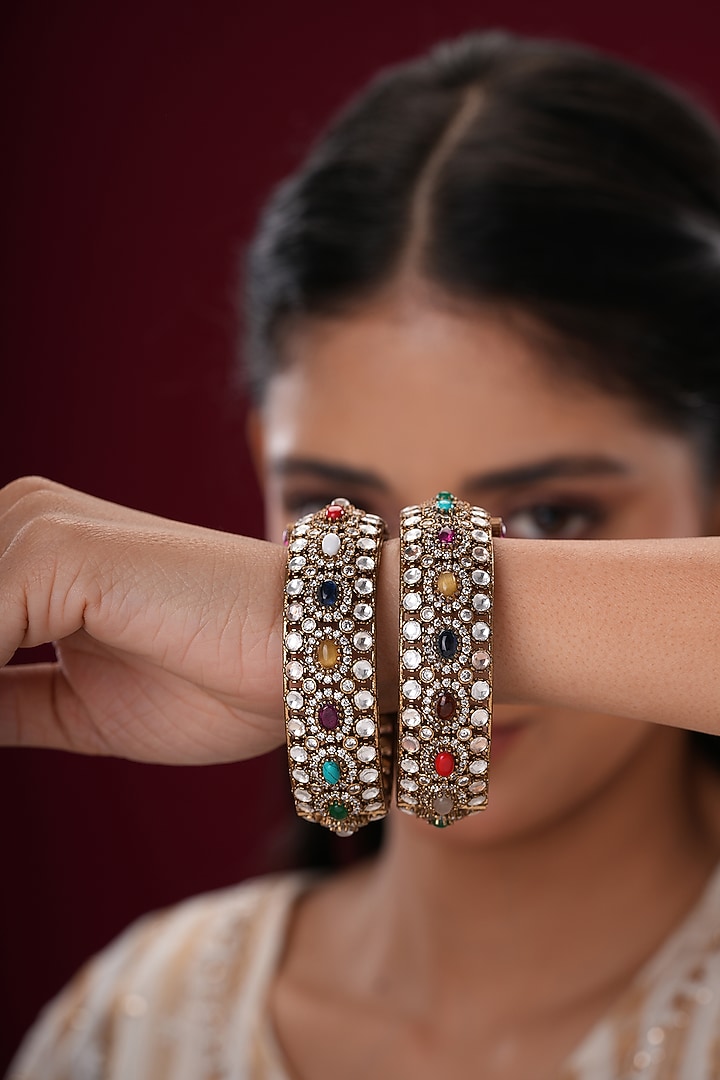 Gold Finish Kundan Polki & Multi-Colored Stone Bangles (Set Of 2) by EKATHVA JAIPUR at Pernia's Pop Up Shop