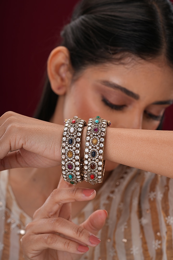 Gold Finish Kundan Polki & Multi-Colored Stone Bangles (Set Of 2) by EKATHVA JAIPUR at Pernia's Pop Up Shop