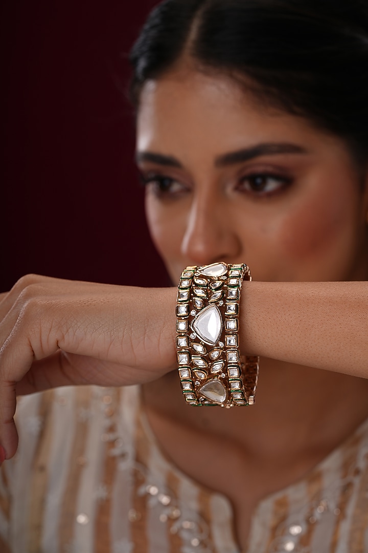 Gold Finish Kundan Polki Bangles (Set Of 2) by EKATHVA JAIPUR at Pernia's Pop Up Shop