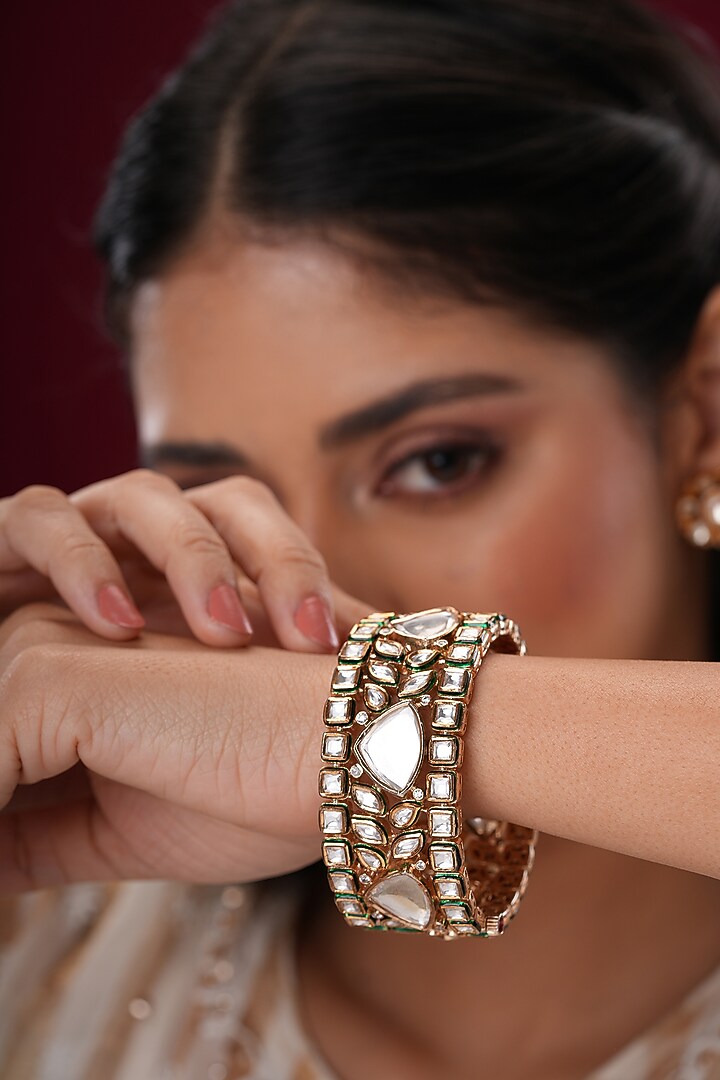Gold Finish Kundan Polki Bangles (Set Of 2) by EKATHVA JAIPUR at Pernia's Pop Up Shop