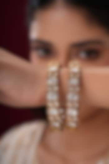 Gold Finish Kundan Polki Bangles (Set Of 2) by EKATHVA JAIPUR at Pernia's Pop Up Shop