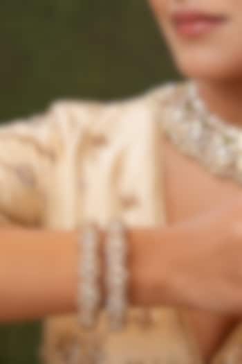 Gold Finish Kundan Polki Bangles (Set Of 2) by EKATHVA JAIPUR at Pernia's Pop Up Shop