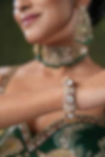 Gold Finish Cubic Zirconia & Red Tourmaline Stone Bangles (Set Of 2) by EKATHVA JAIPUR at Pernia's Pop Up Shop