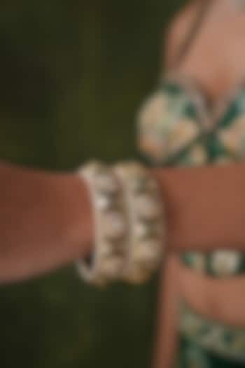 Gold Finish Kundan Polki & Green Stone Bangles (Set Of 2) by EKATHVA JAIPUR at Pernia's Pop Up Shop