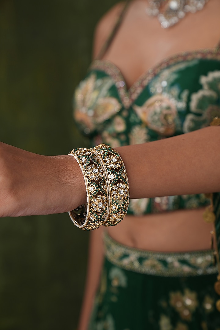 Gold Finish Kundan Polki & Green Stone Bangles (Set Of 2) by EKATHVA JAIPUR at Pernia's Pop Up Shop
