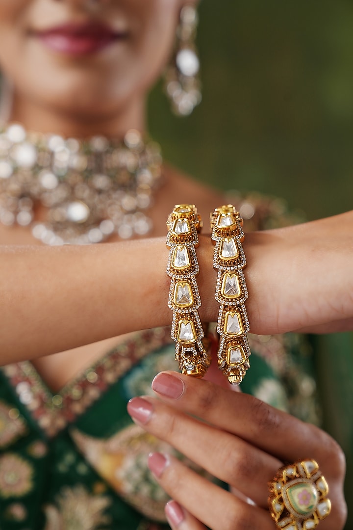 Gold Finish Kundan Polki Bangles (Set Of 2) by EKATHVA JAIPUR at Pernia's Pop Up Shop