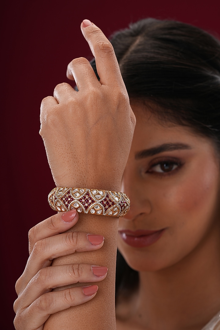 Gold Finish Kundan Polki & Red Stone Bangles (Set Of 2) by EKATHVA JAIPUR at Pernia's Pop Up Shop