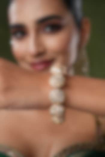 Gold Finish Kundan Polki & Pearl Bangles (Set Of 2) by EKATHVA JAIPUR at Pernia's Pop Up Shop