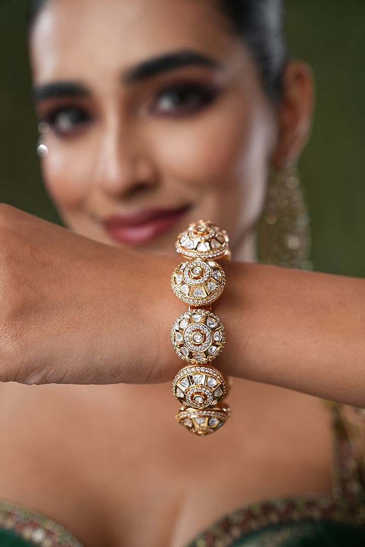 Gold Finish Kundan Polki & Pearl Bangles (Set Of 2) by EKATHVA JAIPUR at Pernia's Pop Up Shop