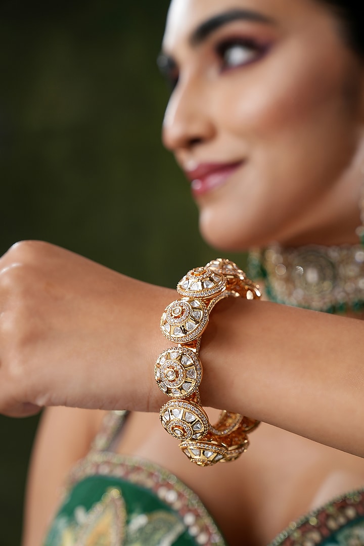Gold Finish Kundan Polki & Pearl Bangles (Set Of 2) by EKATHVA JAIPUR at Pernia's Pop Up Shop