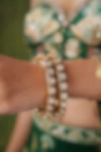 Gold Finish Kundan Polki & Pearl Bangles (Set Of 2) by EKATHVA JAIPUR at Pernia's Pop Up Shop