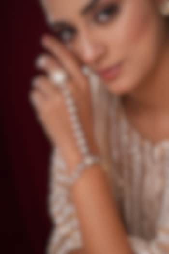 Gold Finish Kundan Polki & Pearl Hathphools (Set Of 2) by EKATHVA JAIPUR at Pernia's Pop Up Shop