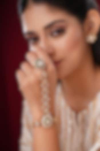 Gold Finish Kundan Polki & Shell Pearl Hathphools (Set Of 2) by EKATHVA JAIPUR at Pernia's Pop Up Shop