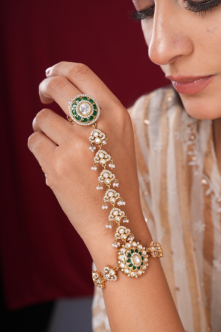 Gold Finish Kundan Polki & Shell Pearl Hathphools (Set Of 2) by EKATHVA JAIPUR at Pernia's Pop Up Shop