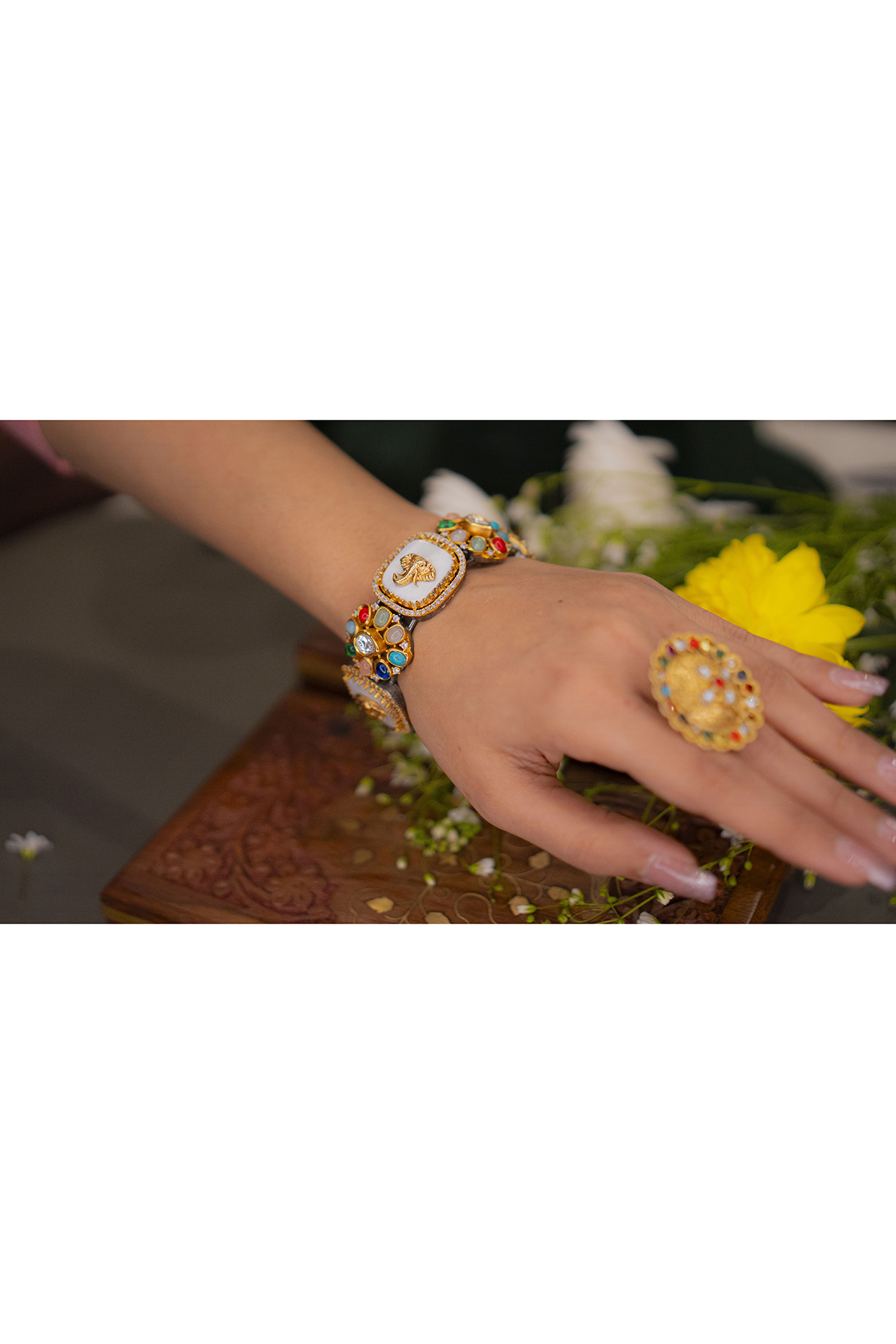 Gold Finish Navratna Stone & Elephant Motif Bangle by EKATHVA JAIPUR at Pernia's Pop Up Shop