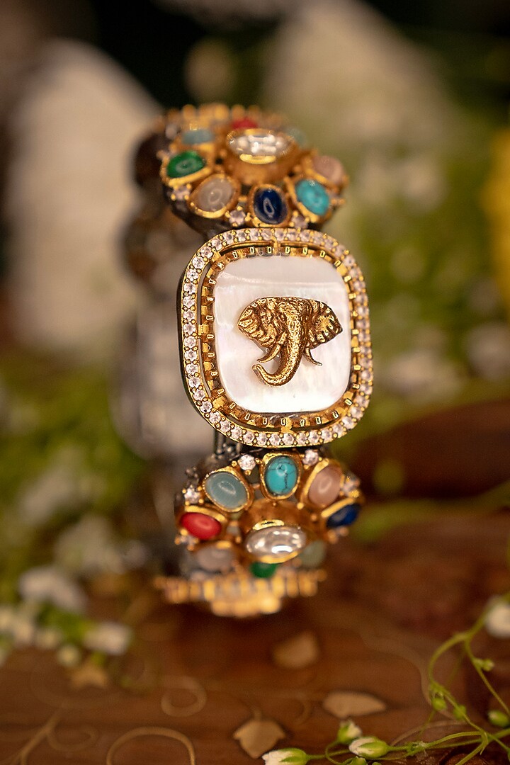 Gold Finish Navratna Stone & Elephant Motif Bangle by EKATHVA JAIPUR at Pernia's Pop Up Shop