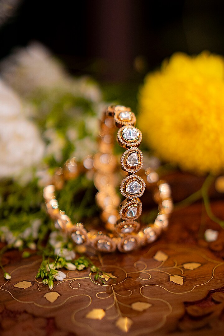 Gold Finish Uncut Polki & Cubic Zirconia Bangles (Set Of 2) by EKATHVA JAIPUR at Pernia's Pop Up Shop