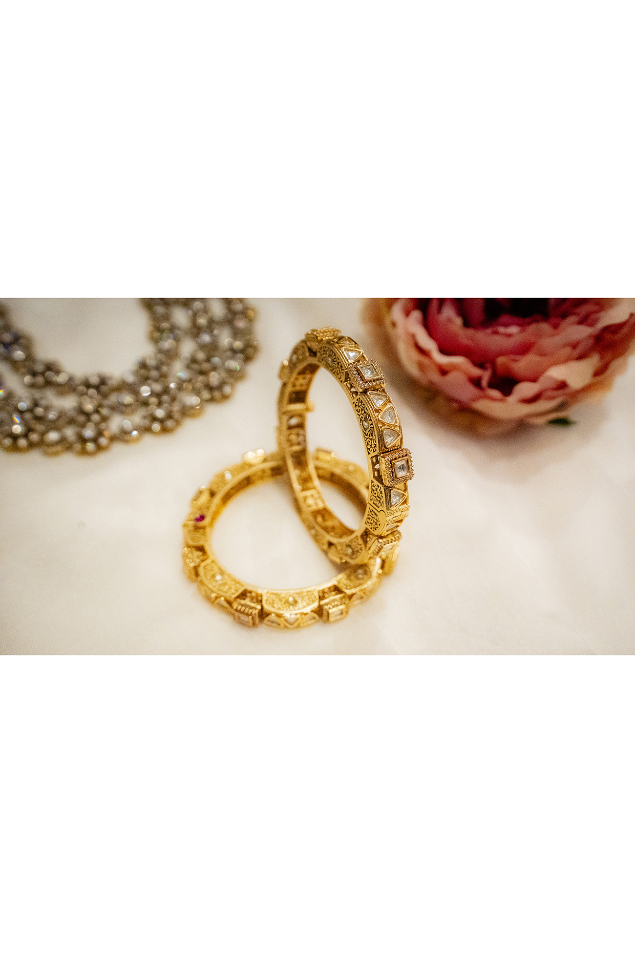Gold Finish Kundan Polki Meenakari Bangles (Set Of 2) by EKATHVA JAIPUR at Pernia's Pop Up Shop