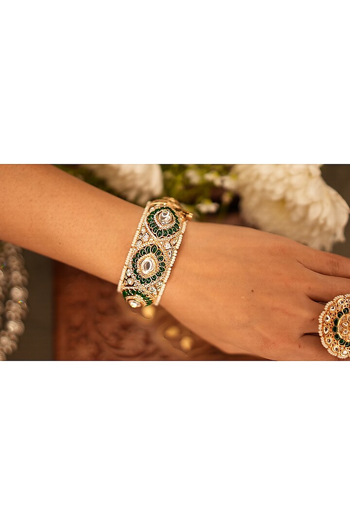 Gold Finish Moissanite Polki & Emerald Stone Kada by EKATHVA JAIPUR at Pernia's Pop Up Shop