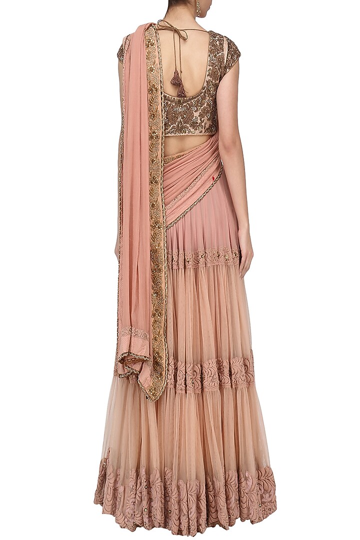 Peach tiered lehenga saree with embroidered blouse available only at Pernia's Pop Up Shop.
