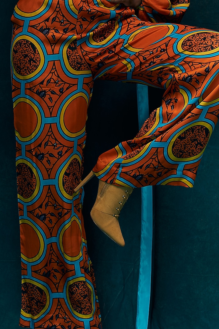 Orange Modal Satin D-ring Pants by Esha L Amin at Pernia's Pop Up Shop