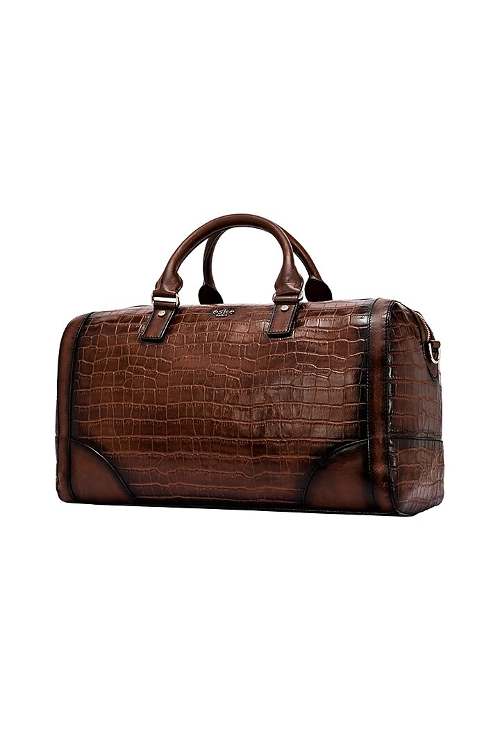 Tan Embossed Leather Duffle Bag by ESKE at Pernia's Pop Up Shop