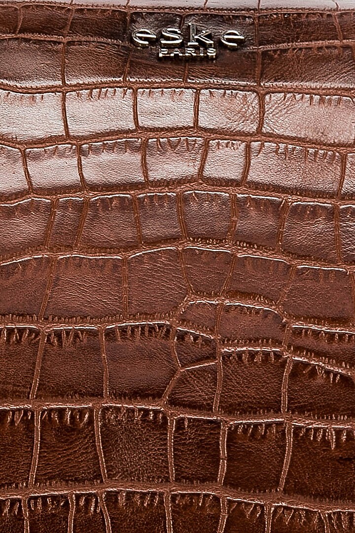 Tan Embossed Leather Duffle Bag by ESKE at Pernia's Pop Up Shop