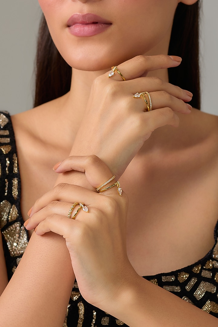 Gold Plated Pear-Cut Swarovski Crystal Rings (Set Of 7) by ESME at Pernia's Pop Up Shop