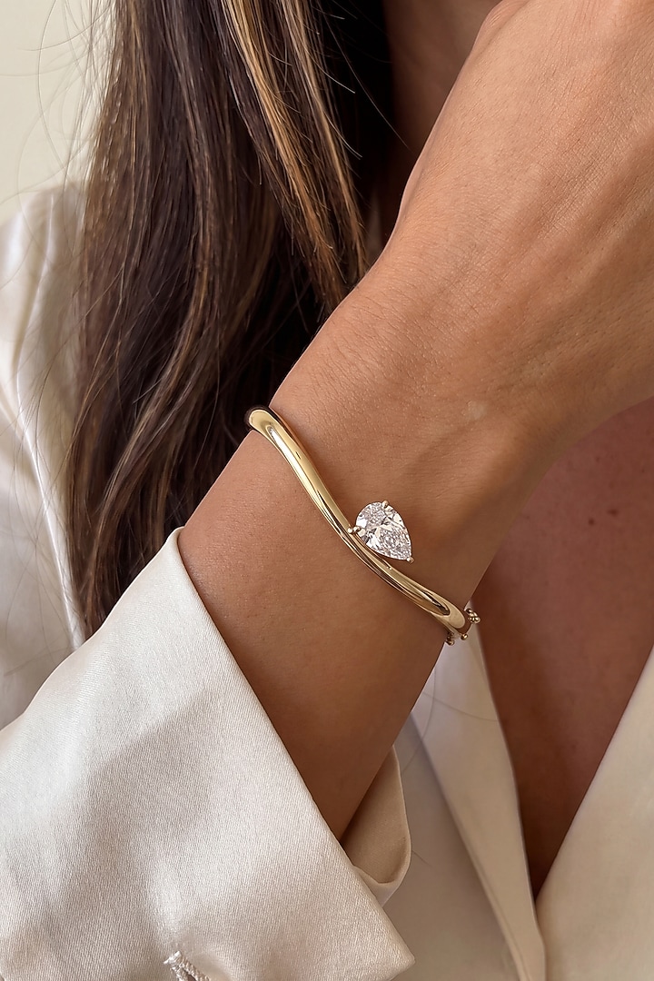 Gold Finish Pear-Shaped Austrian Crystal Bangle by ESME at Pernia's Pop Up Shop