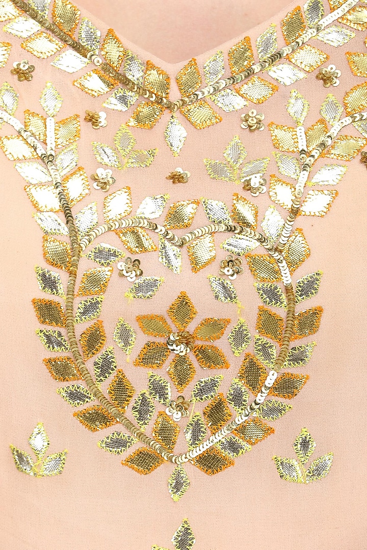 Salmon pink and peach embroidered sharara set available only at Pernia's Pop Up Shop.