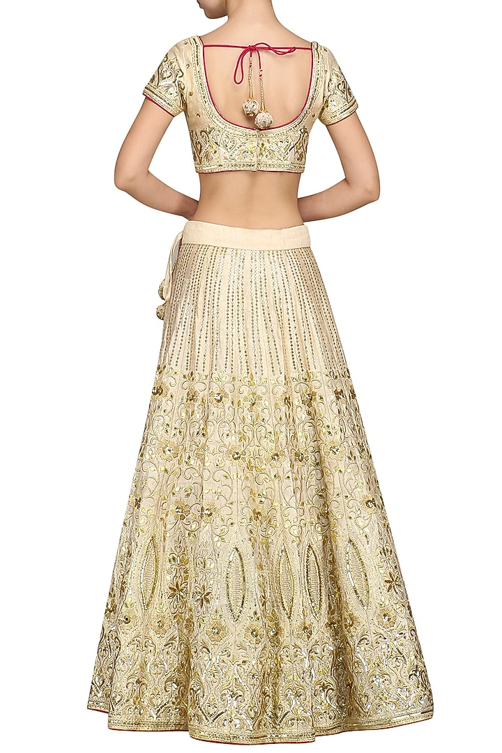 Off white dabka embroidered lehenga set available only at Pernia's Pop Up Shop.