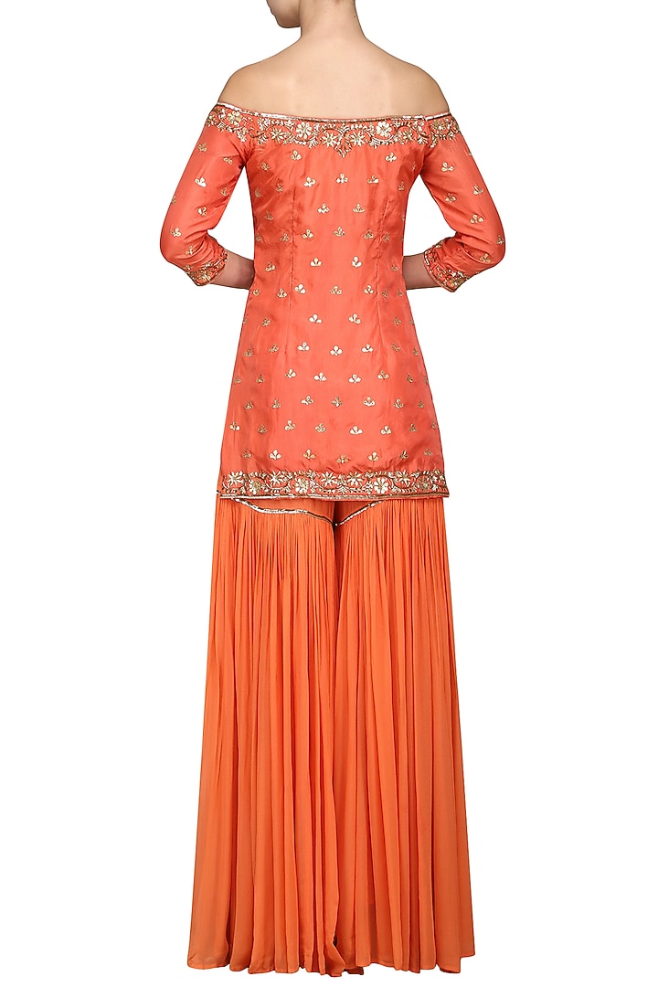 Coral off shoulder sharara set available only at Pernia's Pop Up Shop.
