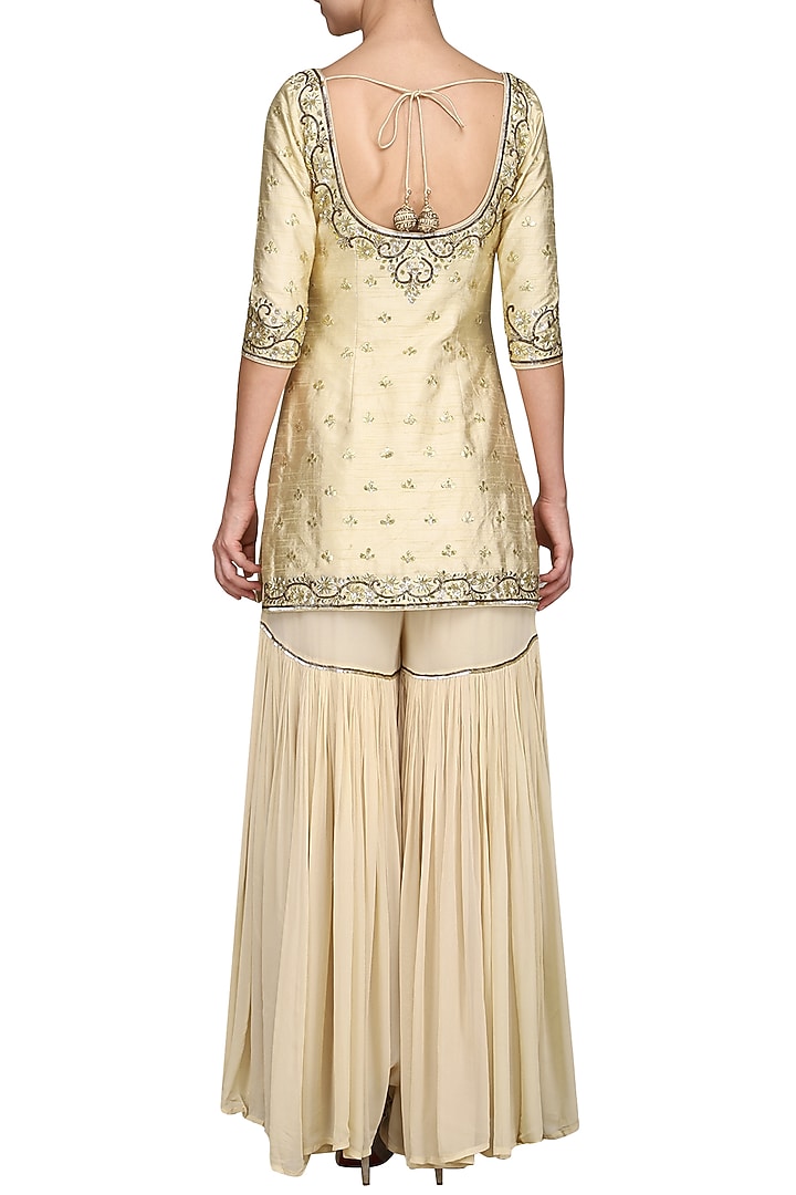 Off white embroidered sharara set available only at Pernia's Pop Up Shop.