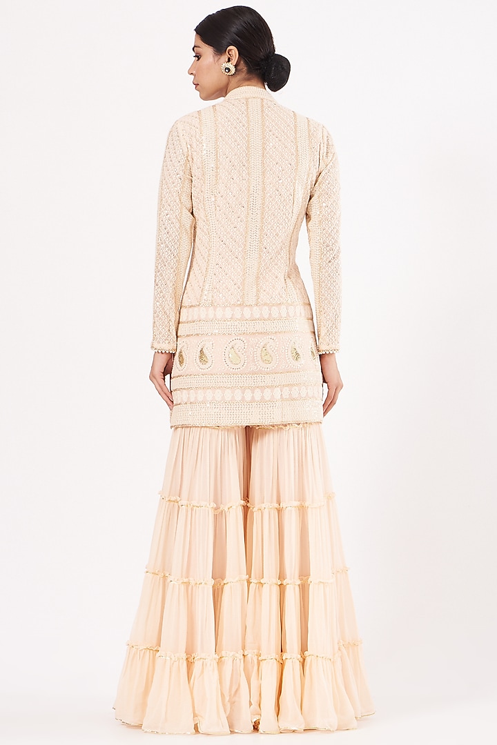 Peach Georgette Frilled Party Wear Sharara Set by EVRA BY NIKITA KHURANA at Pernia's Pop Up Shop