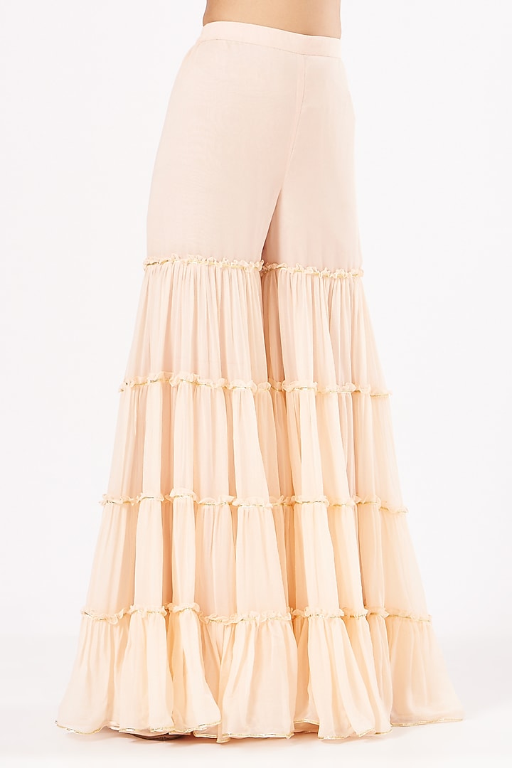 Peach Georgette Frilled Party Wear Sharara Set by EVRA BY NIKITA KHURANA at Pernia's Pop Up Shop