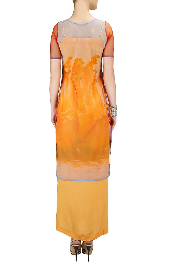 Flamingo print cape with orange slip dress available only at Pernia's Pop-Up Shop.