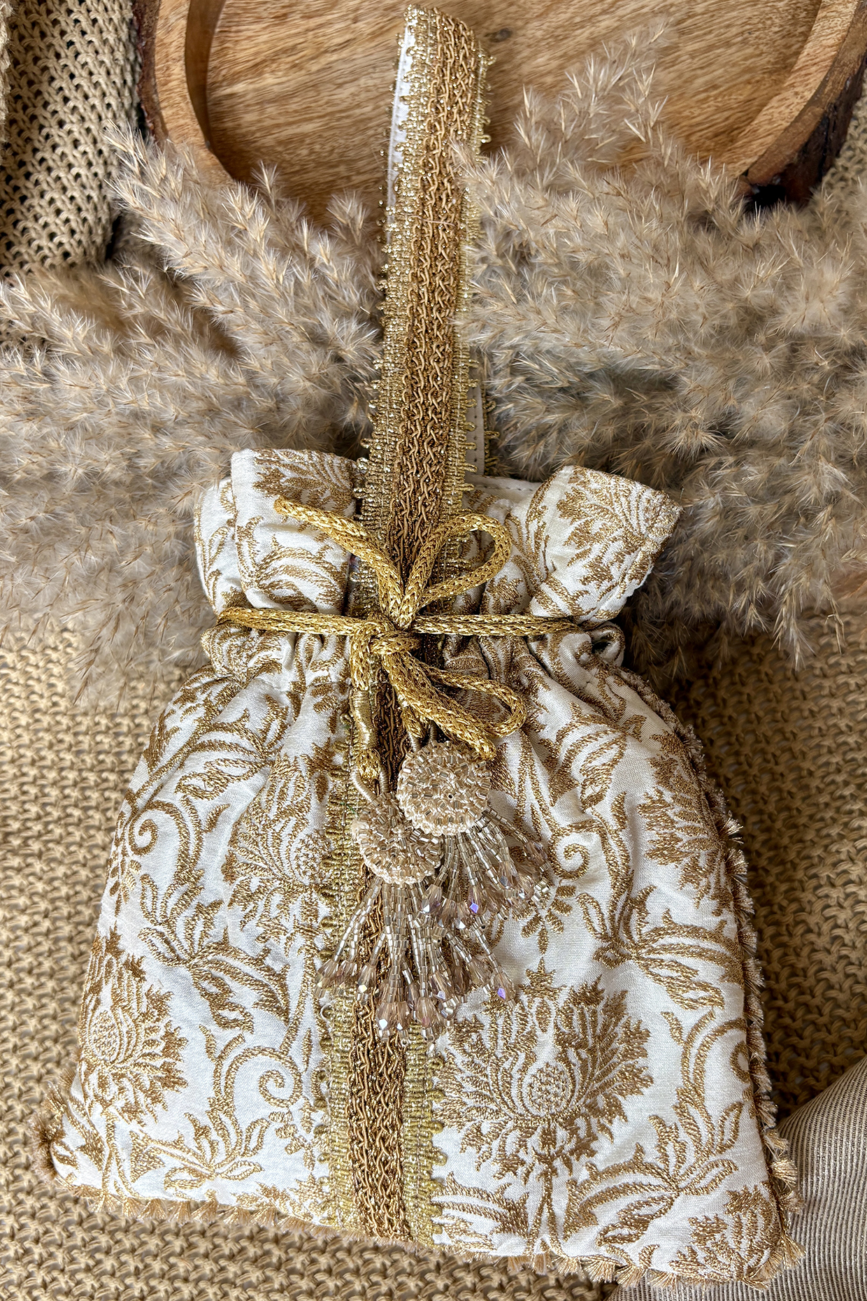 Gold Silk Embroidered Potli Bag by Fuchsia by Aashka Mehta at Pernia's Pop Up Shop