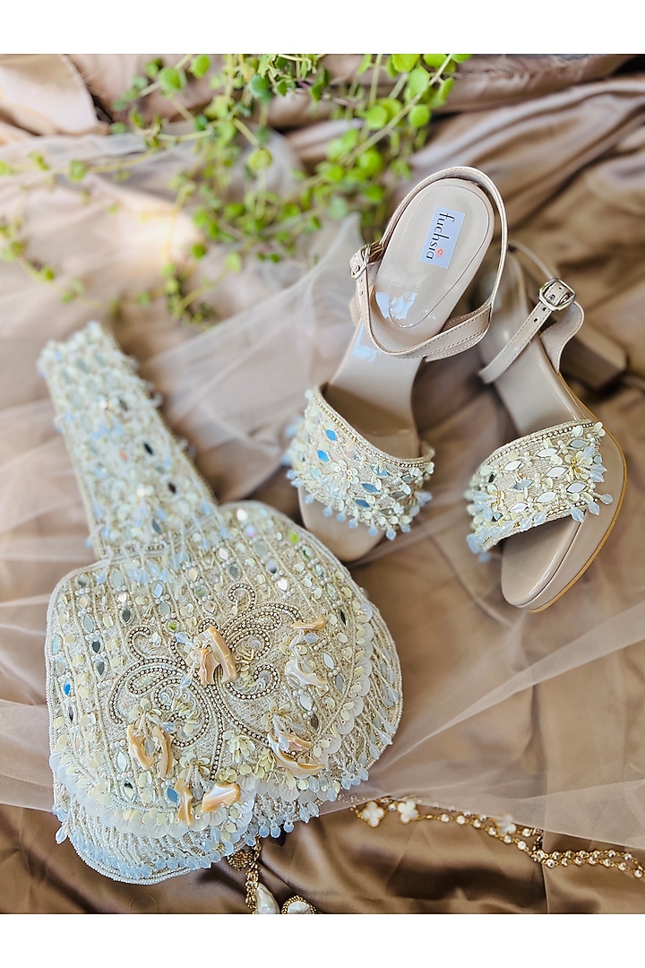 Beige Faux Leather Embellished Potli With Nude Sandals by Fuchsia by Aashka Mehta at Pernia's Pop Up Shop