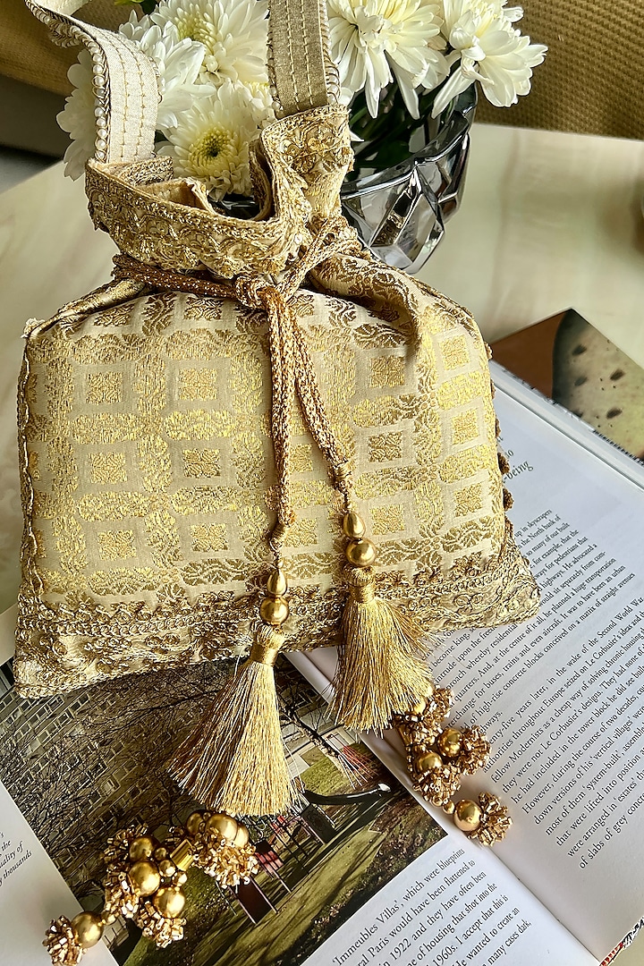 Gold Silk Printed Potli Bag by Fuchsia by Aashka Mehta