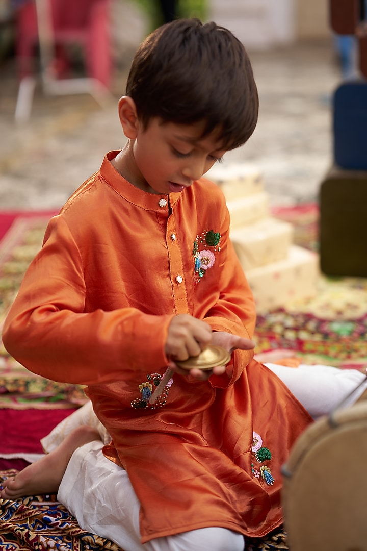 Orange Pure Silk Hand Embroidered Kurta Set For Boys by FUNNY BONES CLOTHINGS at Pernia's Pop Up Shop