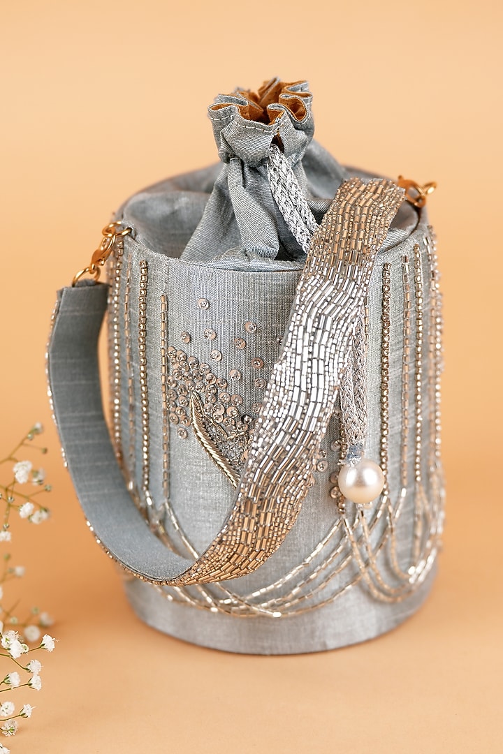 Silver Semi-Raw Silk Hand Embroidered Potli by Feza Bags at Pernia's Pop Up Shop